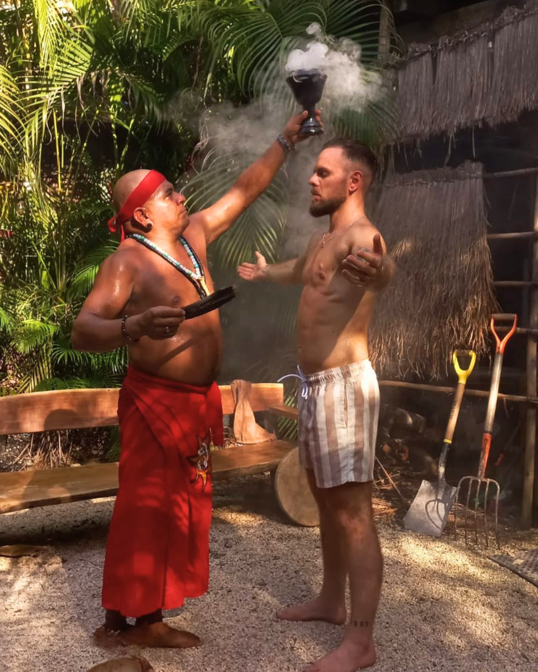 Voy with spiritual teacher in ceremony